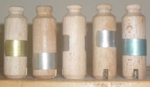 KODAK FILM TINS AND WOODEN FILM ROLL HOLDERS. SEE ILLUSTRATIONS.