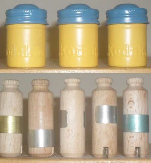KODAK FILM TINS AND WOODEN FILM ROLL HOLDERS. SEE ILLUSTRATIONS.