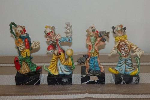 A COLLECTION OF FOUR INCREDIBLE "COLOURFUL" VINTAGE RESIN CLOWNS MOUNTED ON MARBLE BASES bid/clown