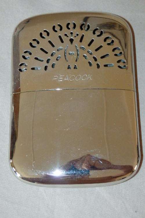 AN AWESOME VINTAGE CHROMED "PEACOCK" OF JAPAN HAND WARMER IN STUNNING CONDITION AND UNUSED