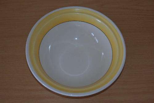A GORGEOUS GRINDLEY OF ENGLAND PORCELAIN SERVING BOWL WITH A BROAD YELLOW RIM