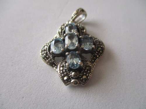 925- Sterling Silver and Blue Topaz Pendant.