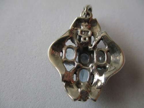 925- Sterling Silver and Blue Topaz Pendant.