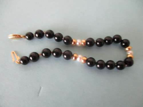 14 ct Gold Clasp, 14k gold spaces, cultured peals and  Black Onyx Bracelet