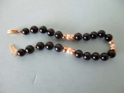 14 ct Gold Clasp, 14k gold spaces, cultured peals and  Black Onyx Bracelet