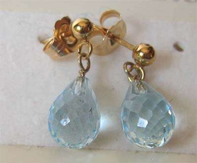 A pair of 14 ct solid Gold and Sky Blue Topaz Earrings