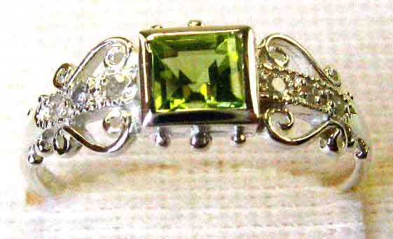 Genuine Peridot and Diamonds Ring.
