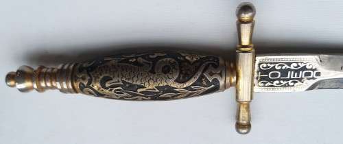 two collectable letter openers Toledo with dragon on handle and s steel made in Japan with knife