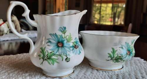Delightful Royal Albert Marguerite cream and sugar with blue daisies.