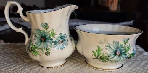 Delightful Royal Albert Marguerite cream and sugar with blue daisies.