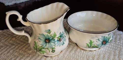 Delightful Royal Albert Marguerite cream and sugar with blue daisies.