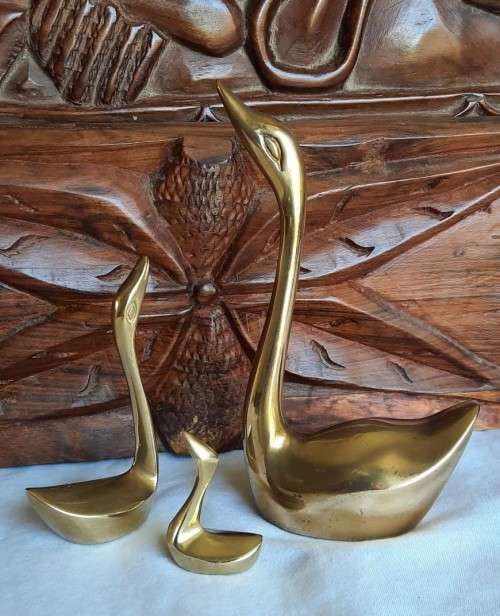 Elegant solid brass family of swans