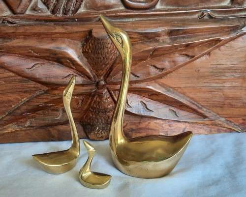 Elegant solid brass family of swans