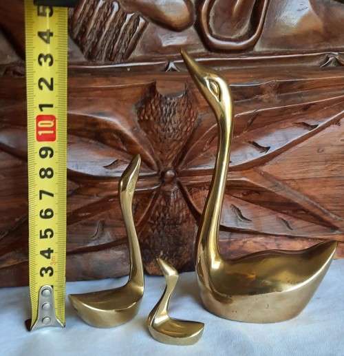 Elegant solid brass family of swans