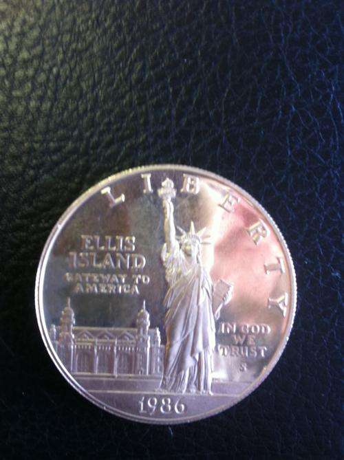 1986 ELLIS ISLAND U.S.A. ONE DOLLAR STRUCK IN .999 SILVER