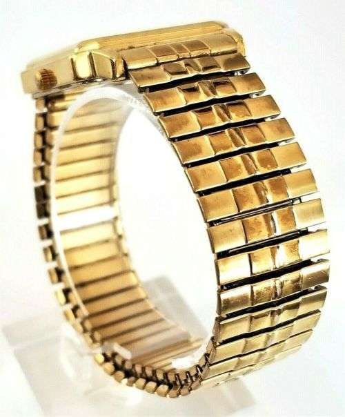 BULOVA GENTS AUTHENTIC GOLD TONE DATE WATCH WITH STRETCH BAND **ONLY ONE AVAILABLE