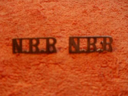 NORTHERN RHODESIA REG SHOULDER TITLES . 1 BRASS . 1 SILVERED BRASS