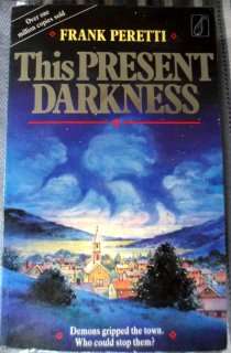 This Present Darkness by FRANK PERETTI - Paperback Copy - Fair to Good - See pic.