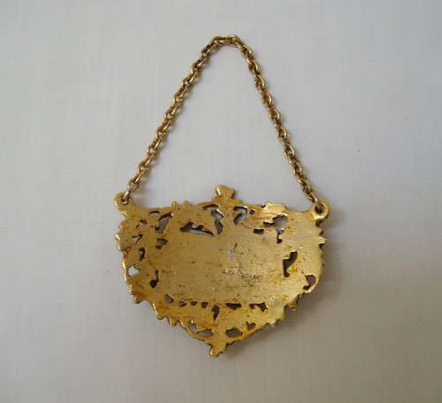 VINTAGE BRASS-PLATED BRANDY DECANTER LABEL