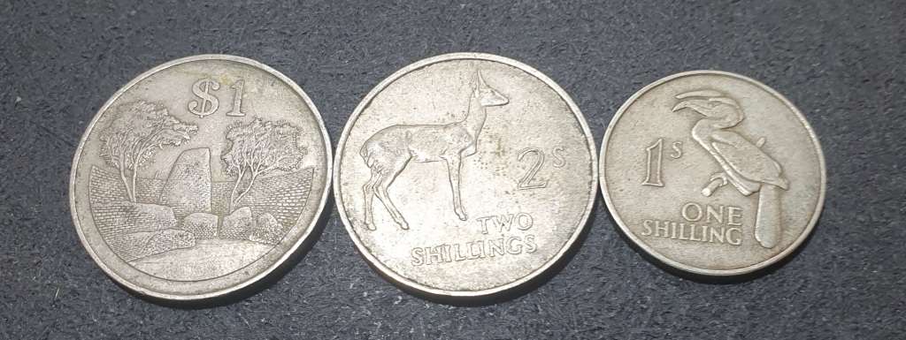 A SET OF THREE ZAMBIAN SHILLINGS & OTHERS.