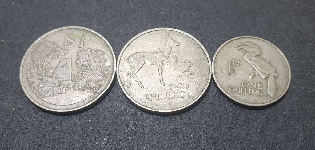 A SET OF THREE ZAMBIAN SHILLINGS & OTHERS.