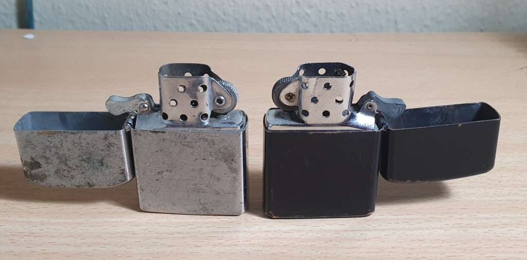 PAIR OF SECONDHAND ZIPPO STYLE LIGHTERS IN WORKING CONDITION.