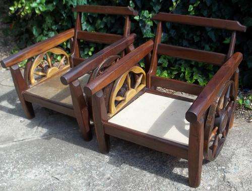 RARE TEAK LOUNGE CHAIRS--- DOUBLE BRASS COVERED WAGON WHEELS