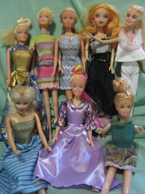 Eight Barbie Style Dolls