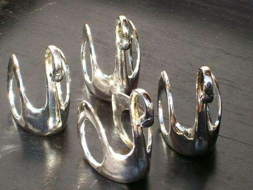 SET OF FOUR SILVER PLATED SWAN NAPKIN RINGS
