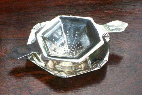 SILVER PLATED TEA STRAINER AND REST