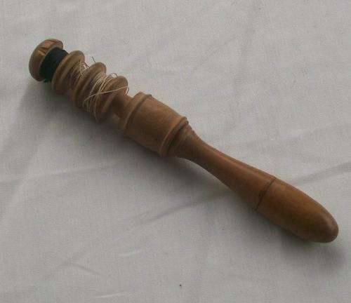 VINTAGE WOODEN BOBBIN WITH AWL