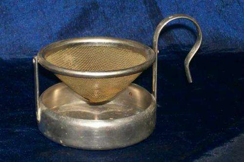 OLD SWIVEL TEA STRAINER