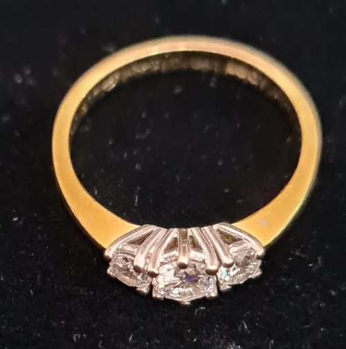 18 carat yellow gold, three diamond ring/ trio ring, with a 0.3 carat stone and two .15 carat stones