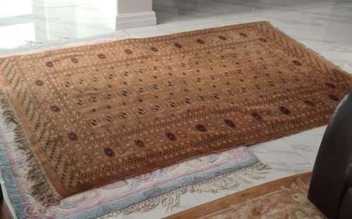 Slightly worn Persian carpet