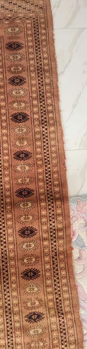 Slightly worn Persian carpet