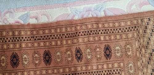 Slightly worn Persian carpet