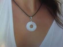 Rhodium plated with pink Mother of Pearl on Black leather thong