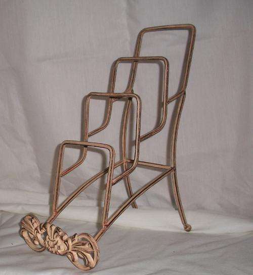 Cast metal plate or book stand