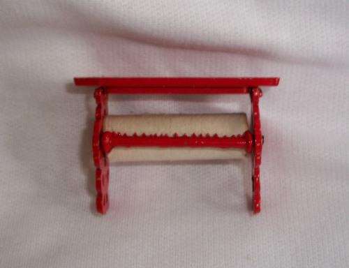 Miniature paper roll holder.