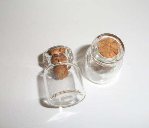 Miniature glass jars.