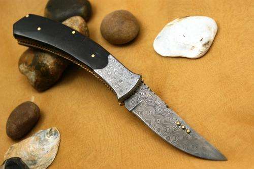 CUSTOM DAMASCUS FOLDING KNIFE WITH POUCH.