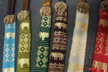 6 WOODEN SETS OF CHOP STICKS IN MATERIAL HOLDERS