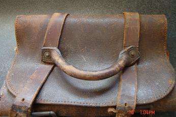 AN OLD LEATHER DOCUMENT HOLDER