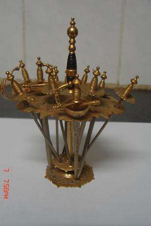 LOVELY LITTLE BRASS SWORDS ON STAND