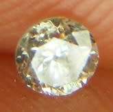 DIAMOND  - 0.11 CARAT TOP LIGHT BROWN, I1  ROUND BRILLIANT DIAMOND 3.05 x1.79mm