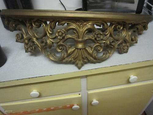 gold gilded shelf