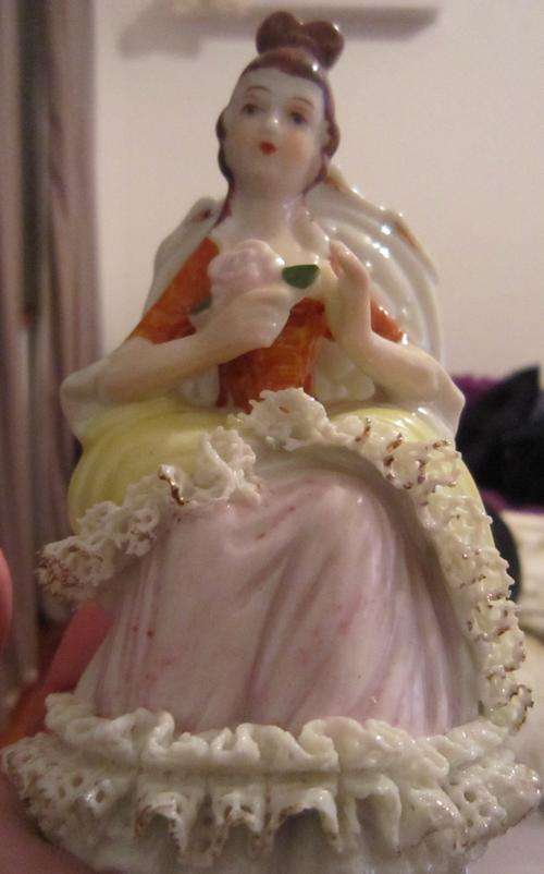 Beautiful figurine of a lady bearing a rose