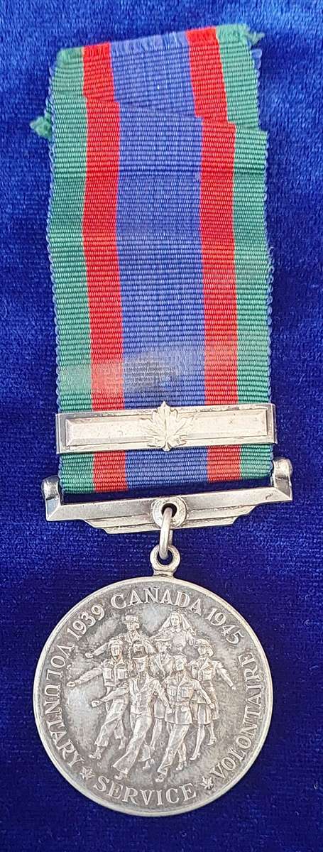- Canadian Volunteer Service medal with Maple Leaf Clasp -