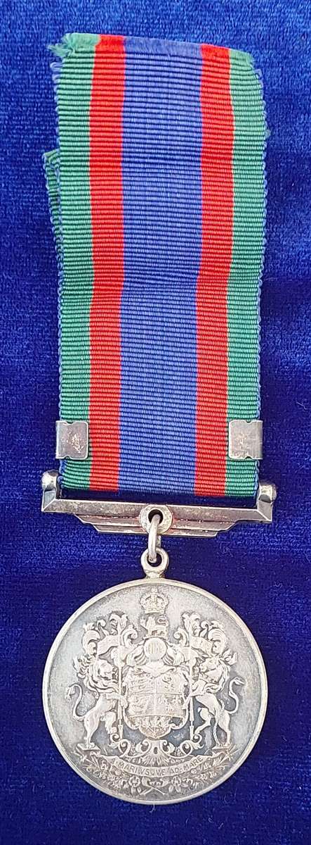 - Canadian Volunteer Service medal with Maple Leaf Clasp -