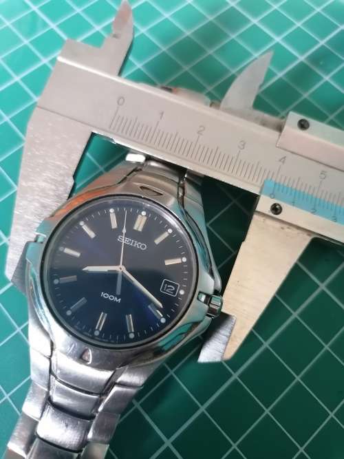 Blue Seiko Quartz with date, steel bracelet